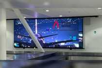 Videowall detras de la cinta de equipaje 4 - Aeropuerto Iquique
